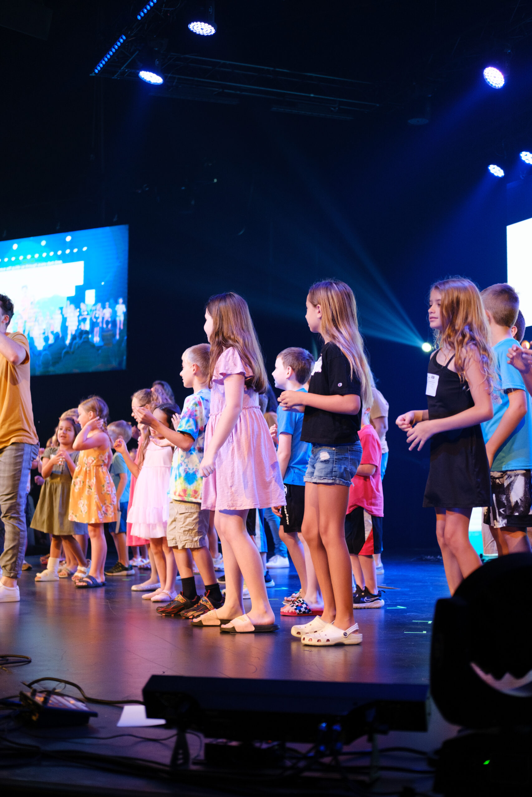 Image of kids ministry performing on stage at church.