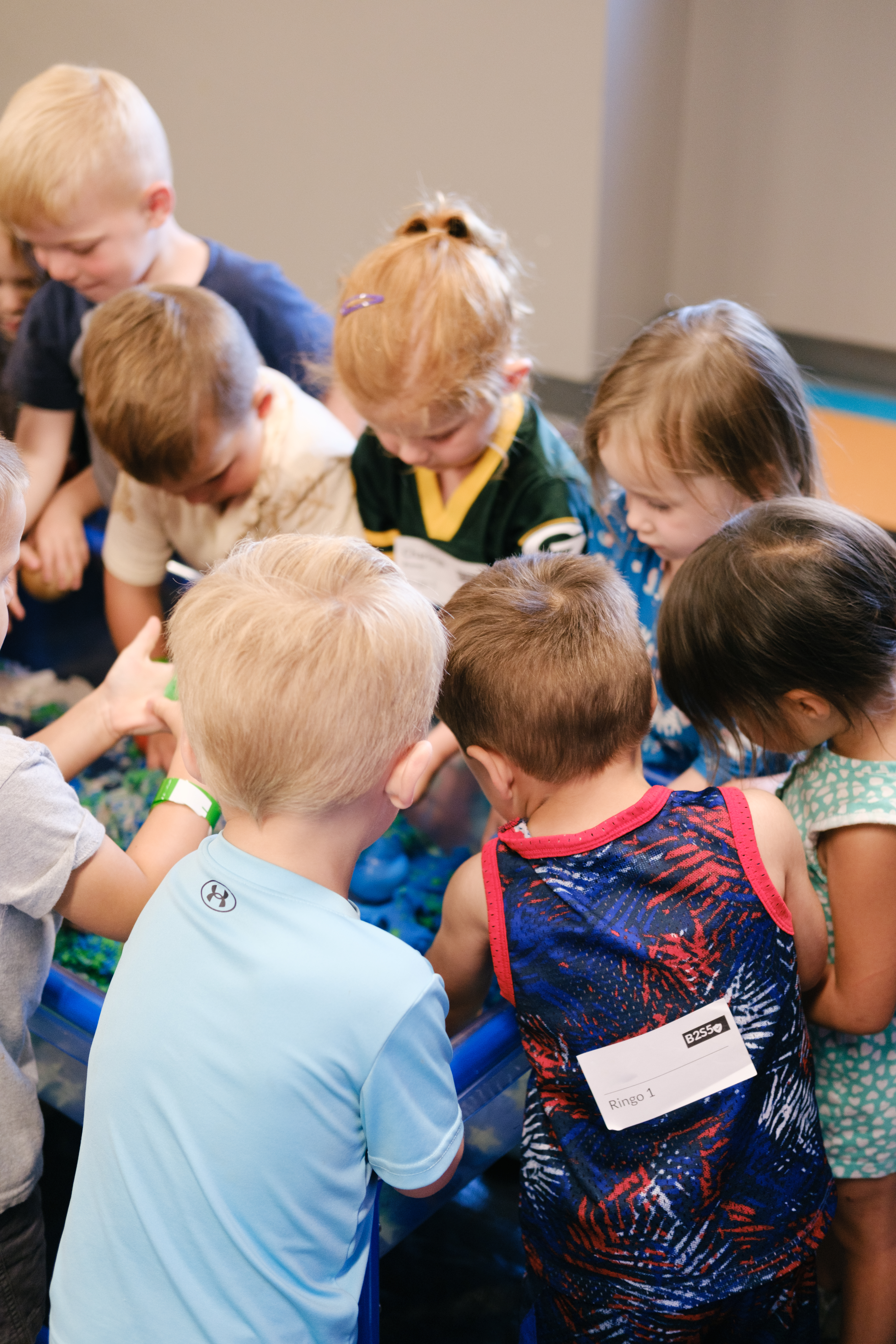 Group of Vineyard Kids praying together.