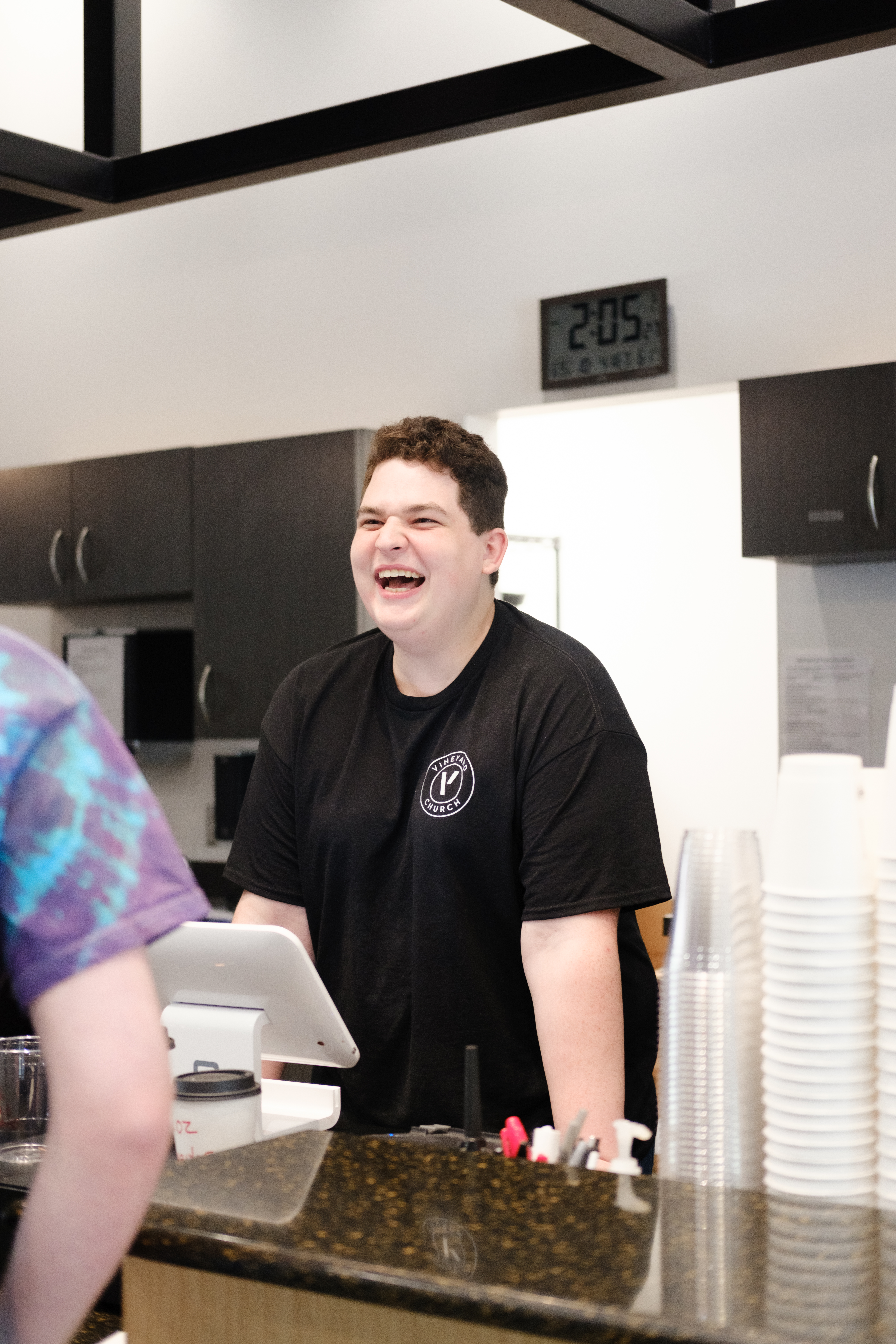 Student from school of ministry working in the coffee shop.